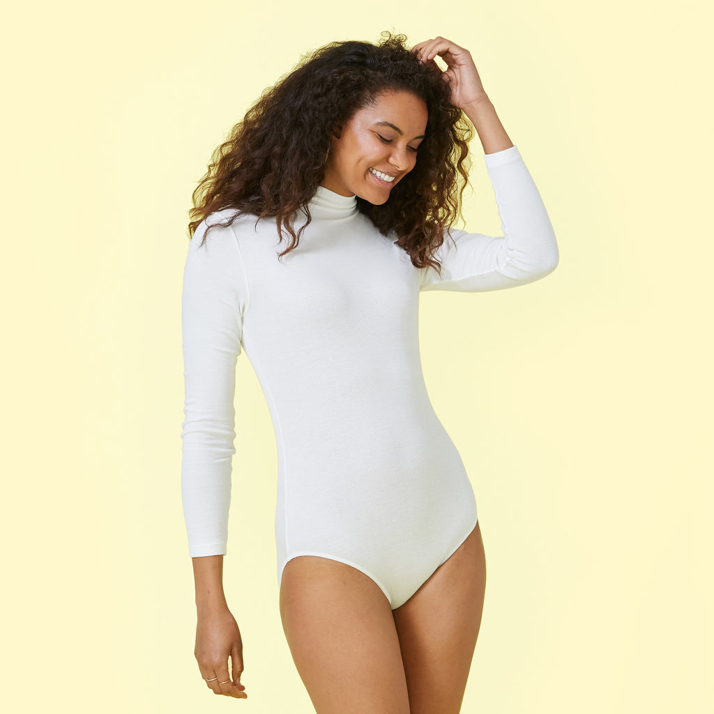 Long sleeve turtleneck bodysuit in white made from Italian yarn
